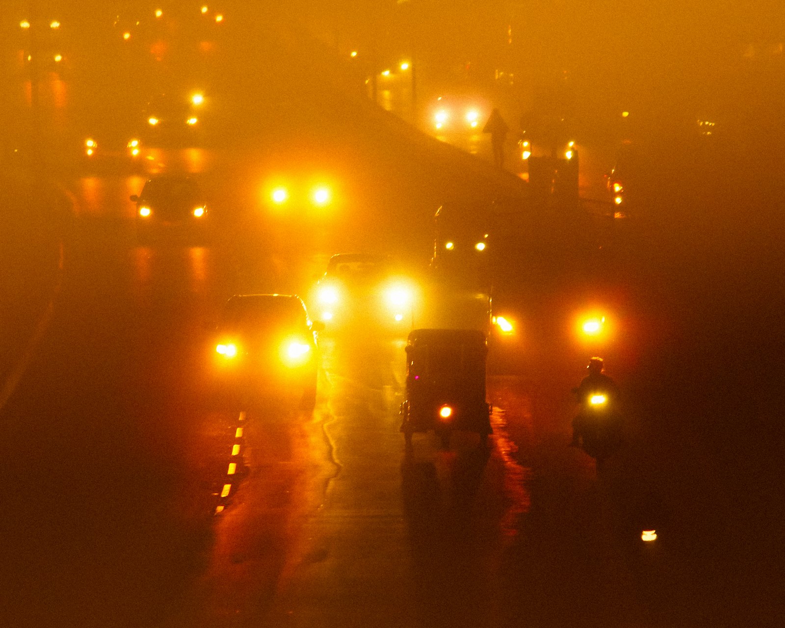 Cabs on an Ahmedabad road at night